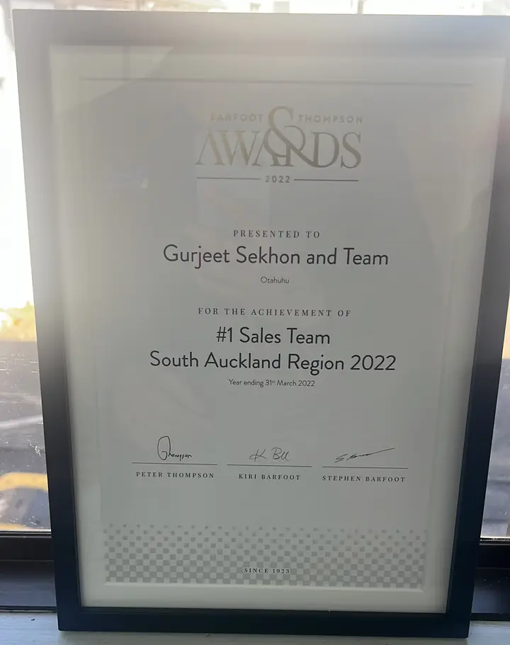 Certificates of achievement for “Gurjeet Sekhon and Team” at a Barfoot & Thompson awards event